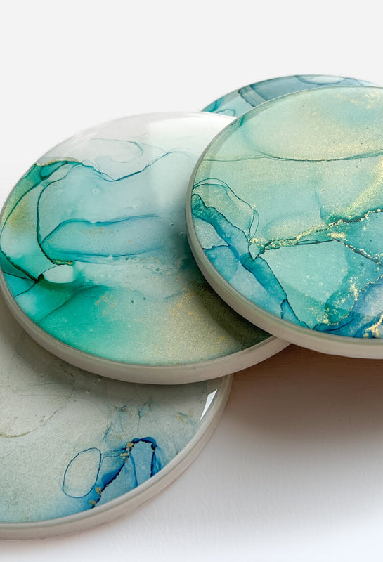 turquoise white and gold alcohol ink coasters